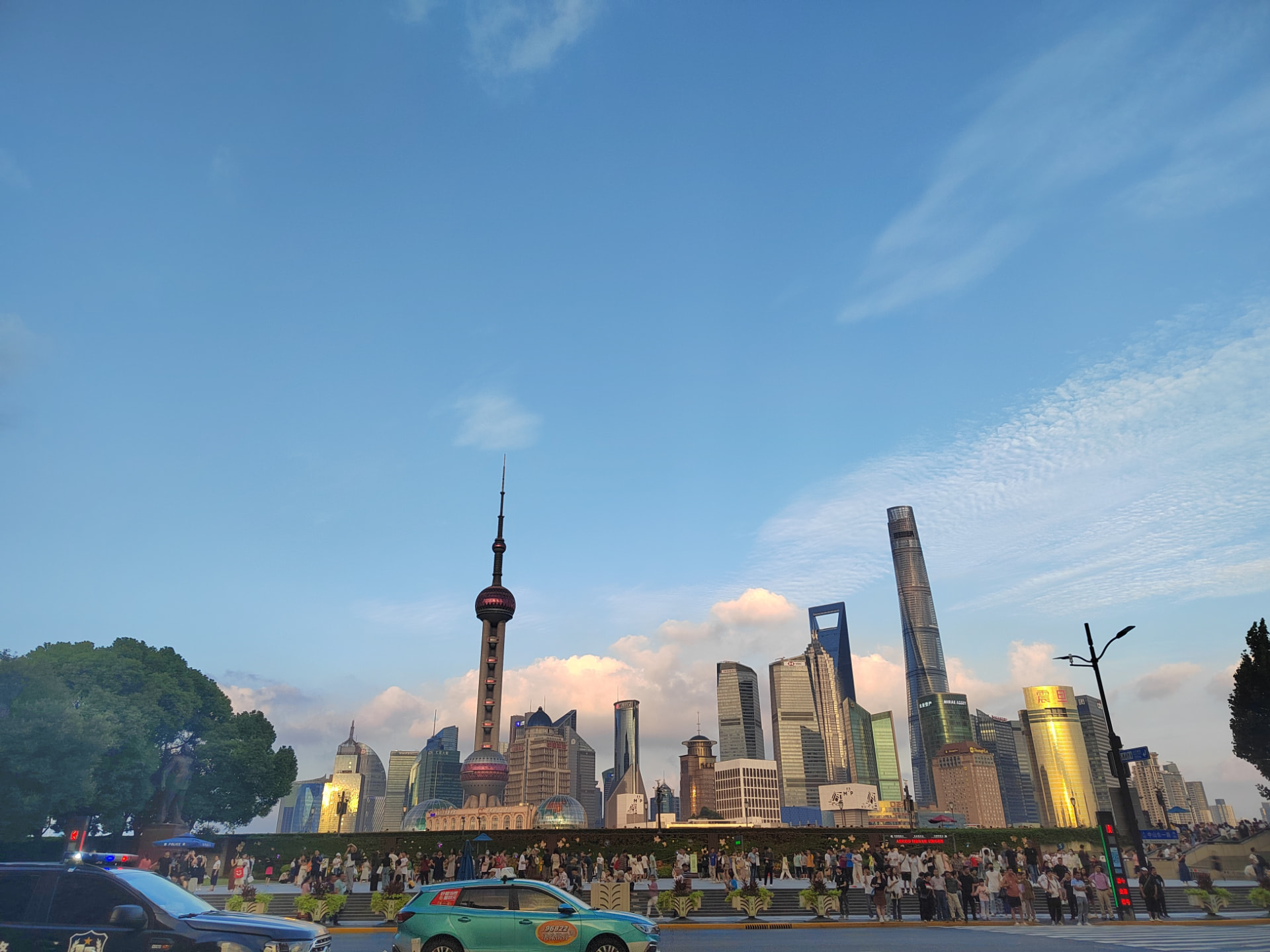 The Shanghai skyline at sunset with the Oriental Pearl Tower and modern skyscrapers
